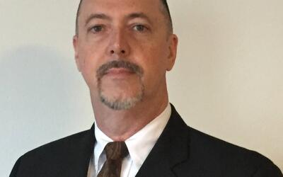 Mark Haire, Technical Sales Specialist at Engineered Recycling Systems, standing beside CCM® filtration equipment, representing 30 years of engineering and sales expertise in industrial recycling solutions.