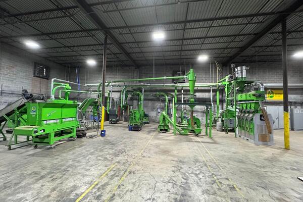 Complete recycling test line at the Engineered Recycling Systems facility in Atlanta, with granulator, cyclones, separation table and overhead aspiration ducting.