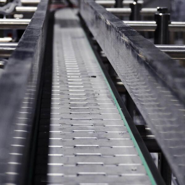 Conveyor systems for efficient scrap material transport by Engineered Recycling Systems — robust industrial conveyors designed for seamless integration with shredders, mills, briquetting presses, and sorting equipment, enabling automated movement of scra