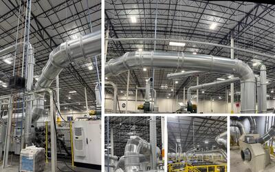 Ongoing installation of a custom dust collection system for a Ward rotary die cutter, showing ductwork, filtration components, and industrial layout inside the facility.