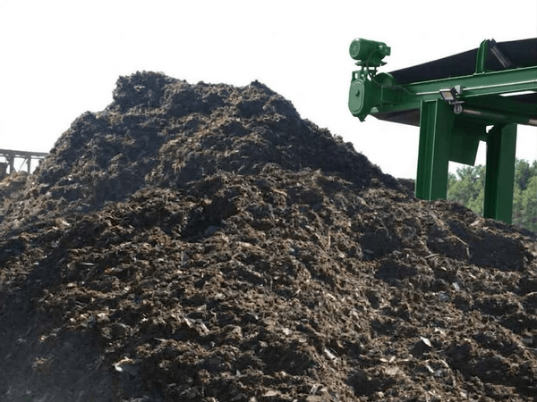 Shredder fines piling up at a scrap yard with no clear plan to recover the metal in it