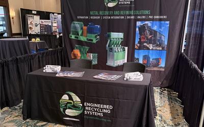 The ERS booth 19 at Southeast ReMA Connect 2026 in Birmingham, showing the Metal Recovery and Refining Solutions banner and a draped ERS table with literature.