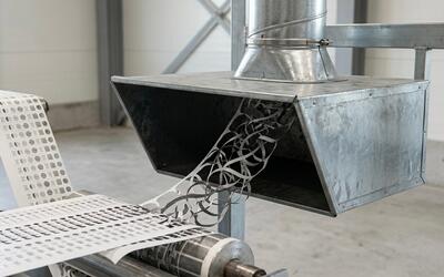 Engineered Recycling Systems LLC supports matrix waste extraction using standard galvanized sheet‑metal hoods for reliable trim removal.