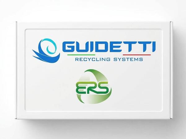 Guidetti Robi dry separation table and PMG pre-shredder side-by-side in a clean U.S. recycling plant with a technician inspecting the machines.