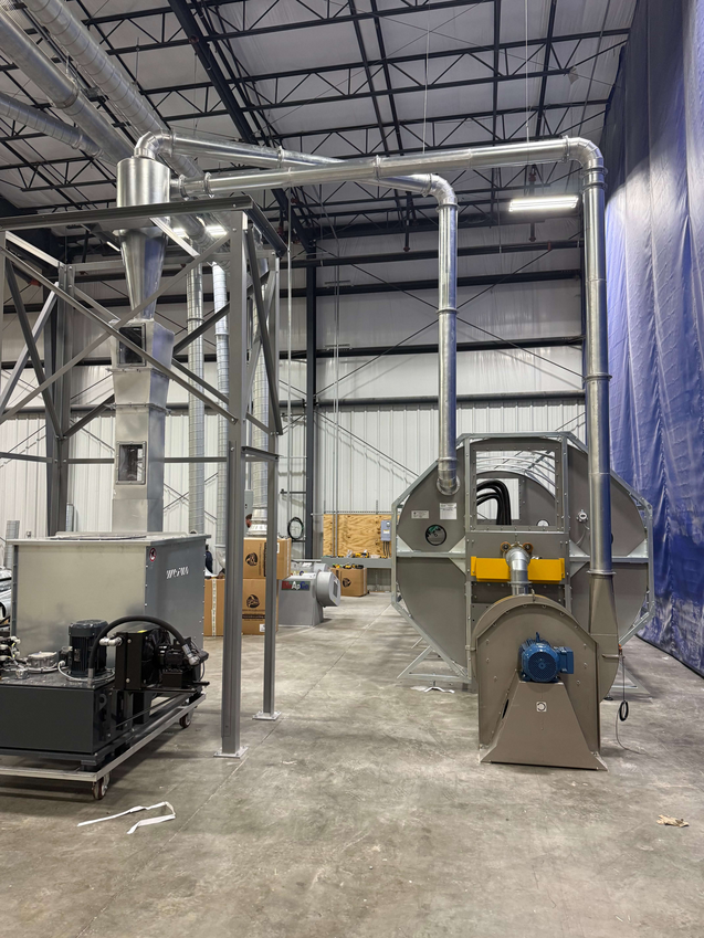 Engineered Recycling Systems CCM® OCT Filter installation in progress at a high-graphic printing and packaging facility, showing ductwork and mechanical components engineered for high-volume dust control and stable airflow.