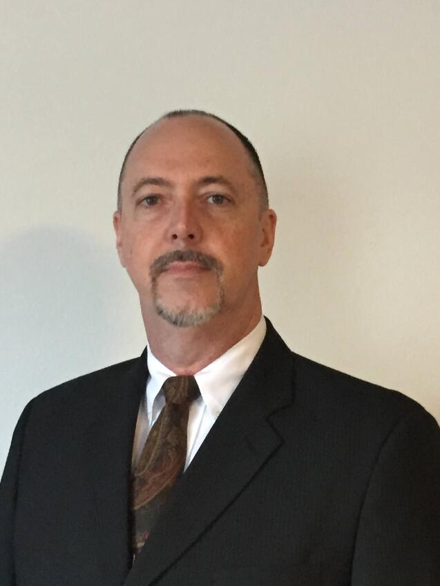 Mark Haire, Technical Sales Specialist at Engineered Recycling Systems, standing beside CCM® filtration equipment, representing 30 years of engineering and sales expertise in industrial recycling solutions.