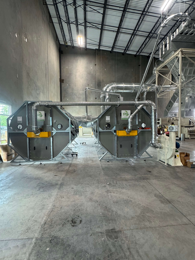 Two ERS CCM® Dust Collection Filters being installed at a corrugated manufacturing facility in 2025