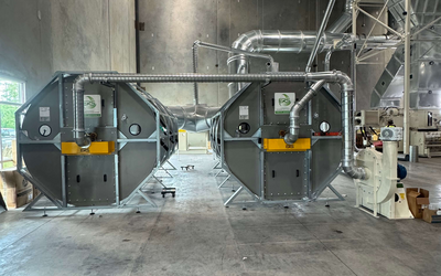 Two ERS CCM® Dust Collection Filters being installed at a corrugated manufacturing facility in 2025