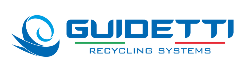 Guidetti Robi dry separation table and PMG pre-shredder side-by-side in a clean U.S. recycling plant with a technician inspecting the machines.