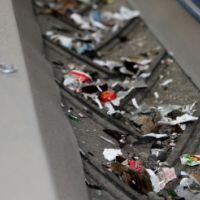 Trougher conveyor systems utilized by Engineered Recycling Systems — heavy-duty bulk material conveyors featuring angled trough-shaped belts supported by multiple rollers, designed for efficient transport of scrap metals, plastics, and industrial waste ac