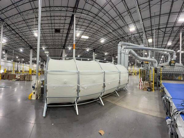 ERS integrated dust filter system operating alongside a corrugated production line—showcasing in-house scrap and dust recovery without external housings or rotary airlocks.