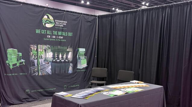 The ERS booth at CEBNA 2026 in Atlanta, with the backdrop banner showing the Turbo 900/5 mill, a wire processing line and an air density separation table.