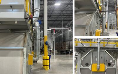 Engineered Recycling Systems high-efficiency dust collection filter installed in a paper and hygiene processing facility, designed to capture fine particulate matter during converting and packaging operations.