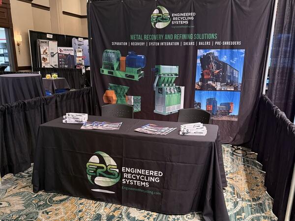 The ERS booth 19 at Southeast ReMA Connect 2026 in Birmingham, showing the Metal Recovery and Refining Solutions banner and a draped ERS table with literature.