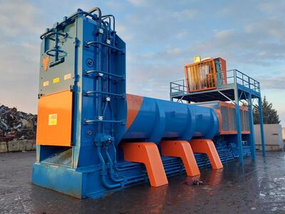 TAURUS BLULINE machine positioned in an industrial recycling yard.