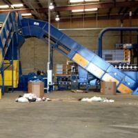 Chain edge conveyor systems utilized by Engineered Recycling Systems — heavy-duty conveyors designed for initial material feed and elevation in scrap processing applications, featuring steel-reinforced belts and rugged chain edges for transporting metals,