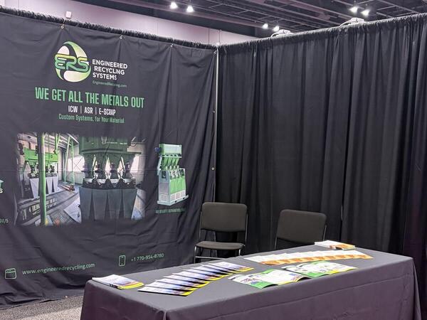 The ERS booth at CEBNA 2026 in Atlanta, with the backdrop banner showing the Turbo 900/5 mill, a wire processing line and an air density separation table.