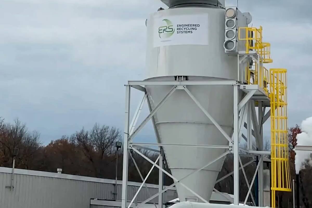 A cyclone separator installed on a plant roof, part of a completed recycling system installation.